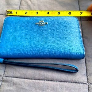 Blue coach wristlet.